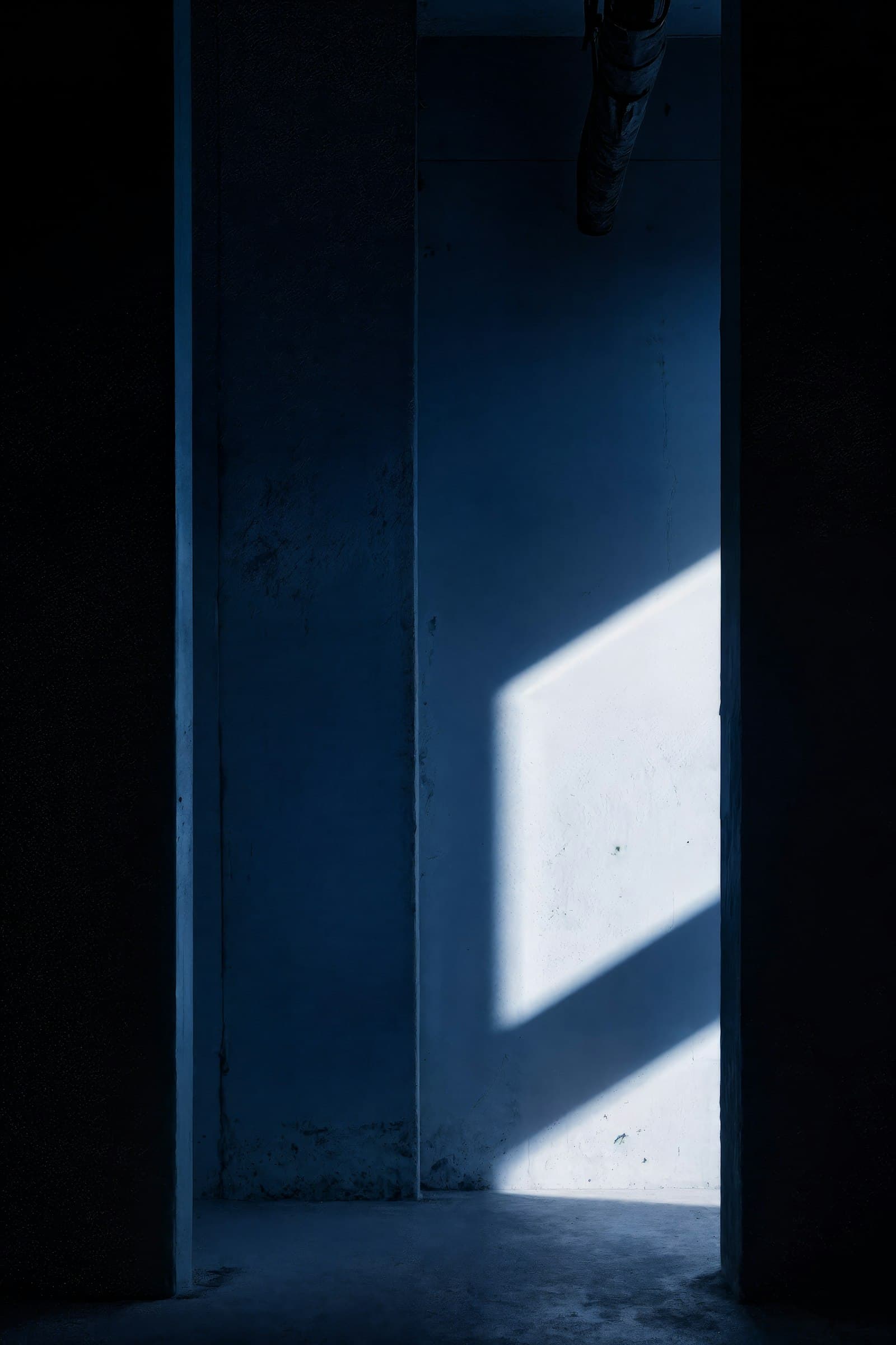 Moody gallery interior with low light and a single artwork